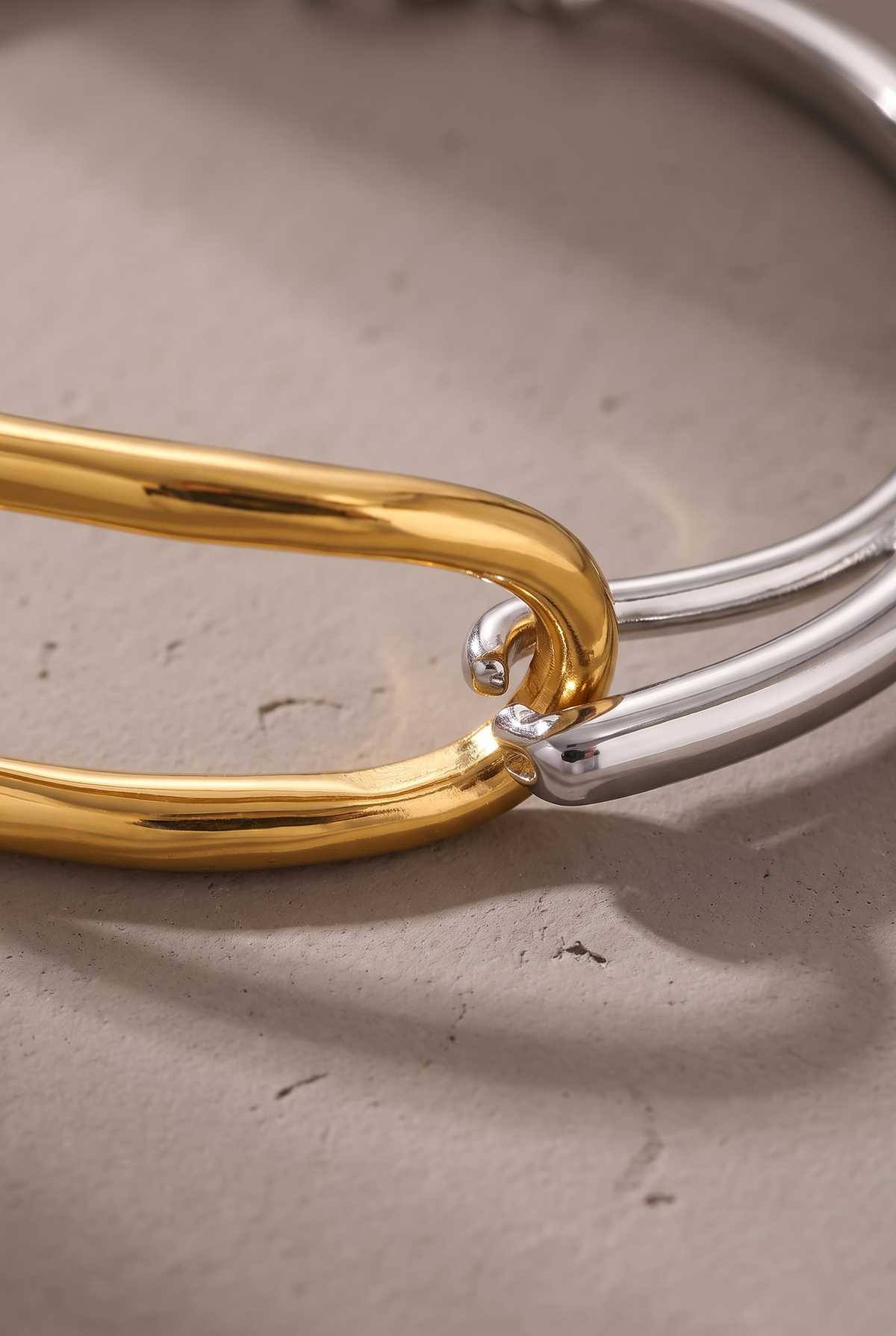 Close-up of the gold link and silver band connection